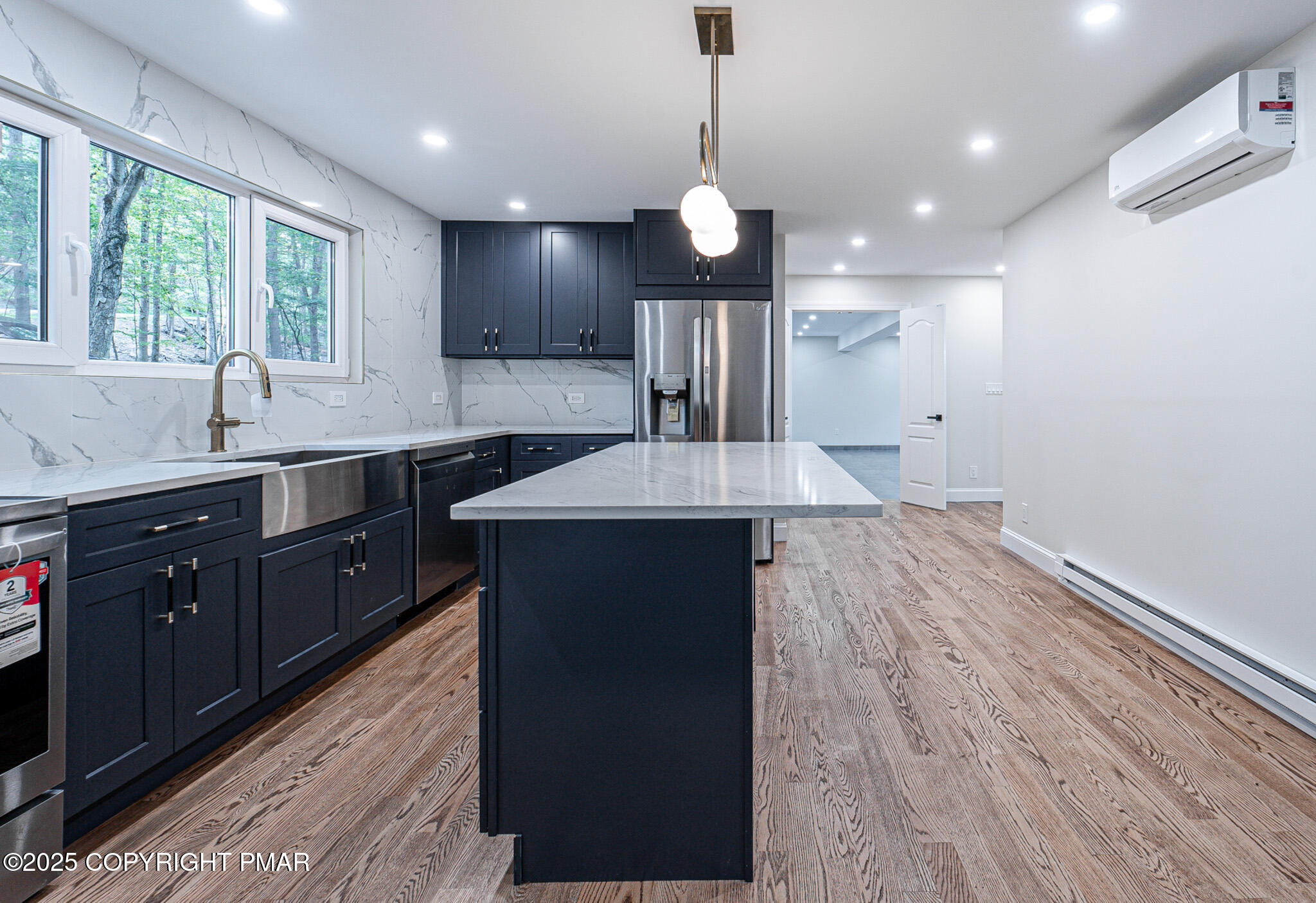 5806 Decker Road Bushkill, PA 18324 - Photo 25 of 76 a large kitchen with kitchen island a sink stainless steel appliances and a window