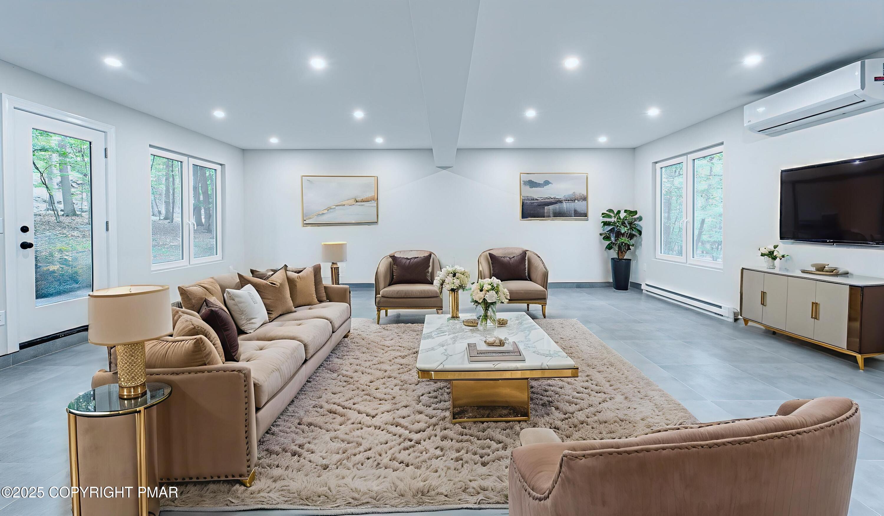 5806 Decker Road Bushkill, PA 18324 - Photo 30 of 76 a living room with furniture and a flat screen tv