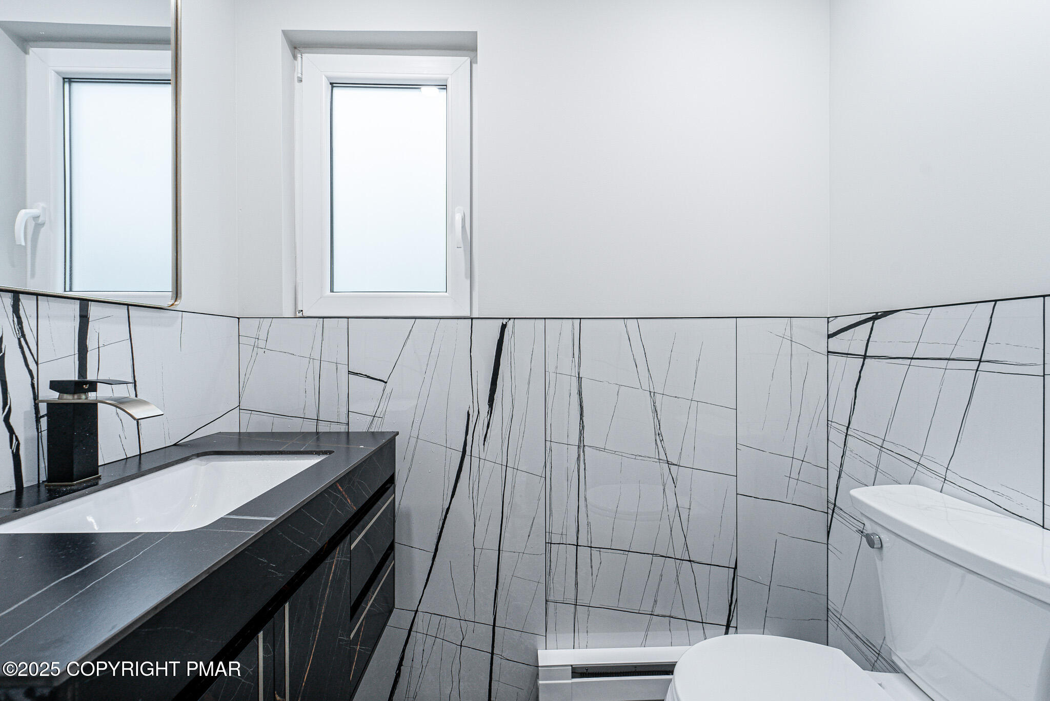 5806 Decker Road Bushkill, PA 18324 - Photo 35 of 76 a bathroom with a sink a toilet and shower