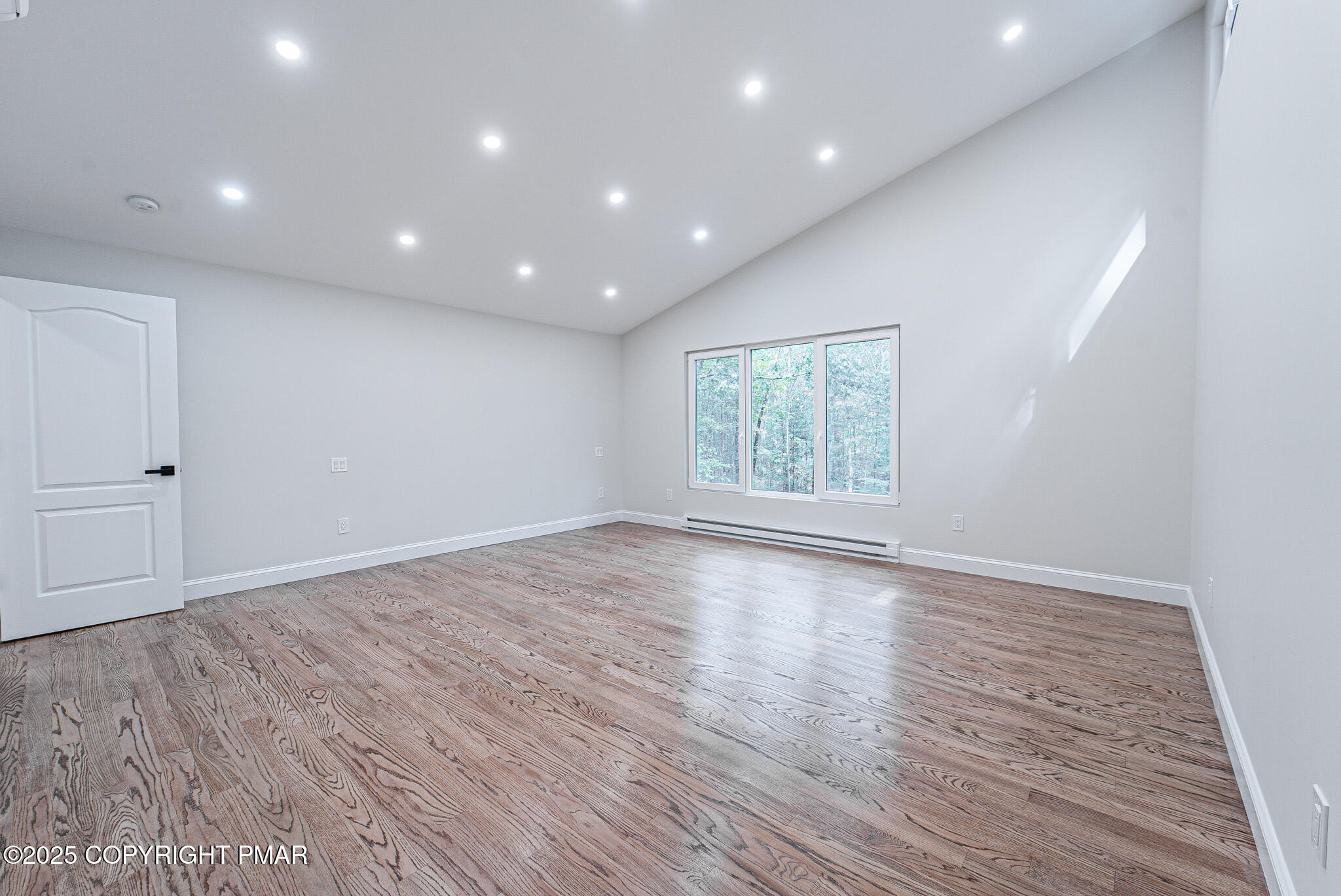 5806 Decker Road Bushkill, PA 18324 - Photo 38 of 76 an empty room with wooden floor and window