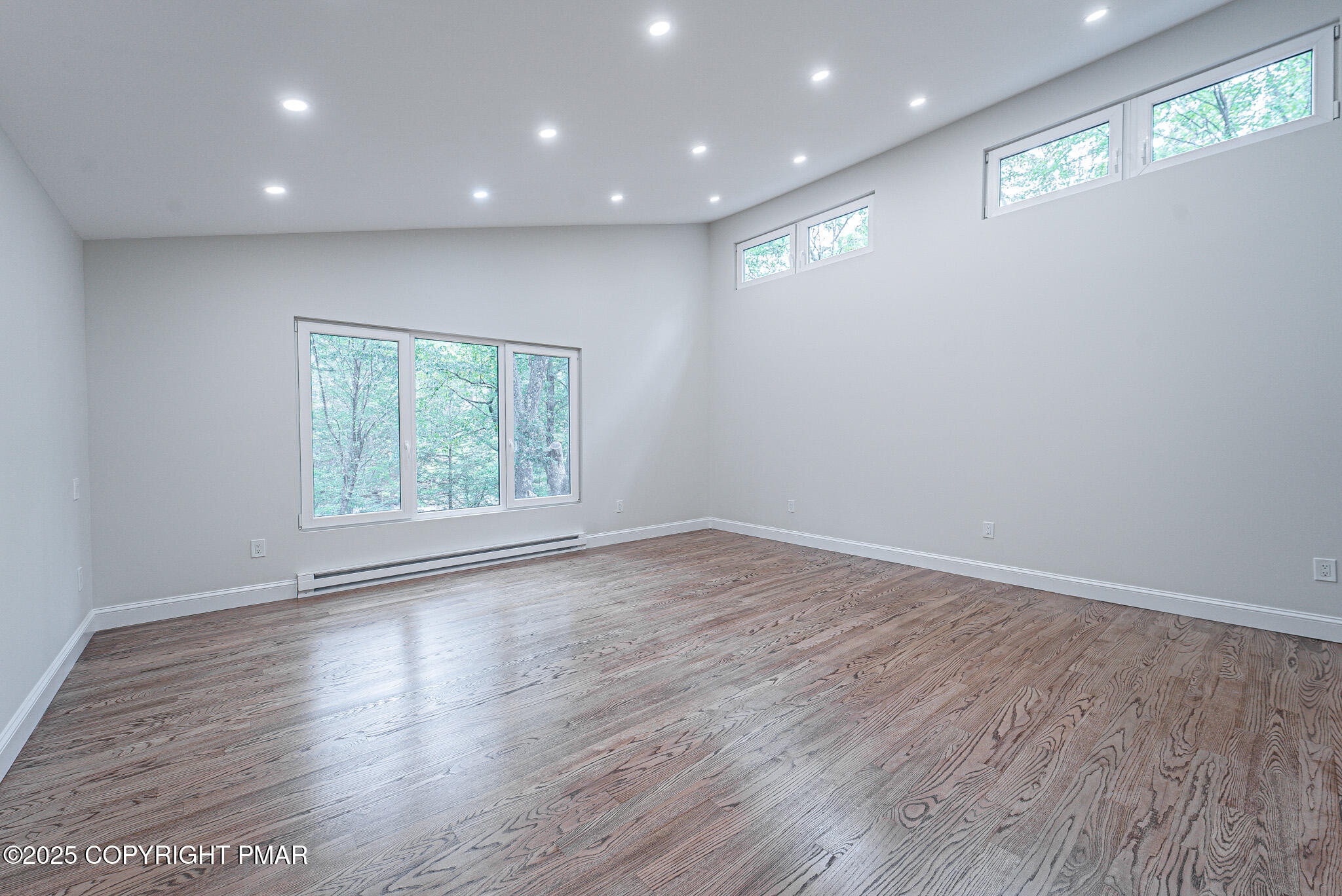 5806 Decker Road Bushkill, PA 18324 - Photo 40 of 76 an empty room with wooden floor and window