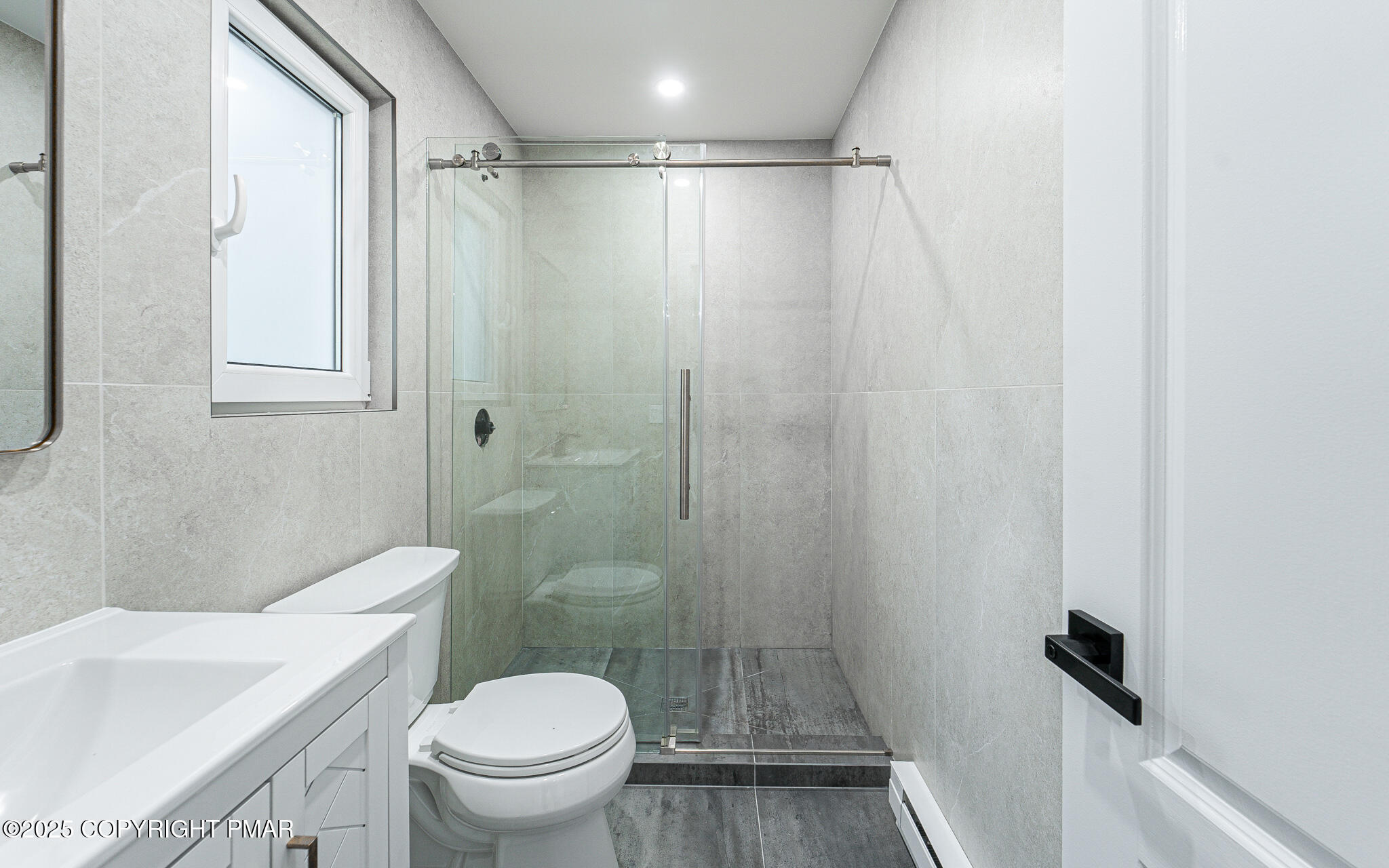 5806 Decker Road Bushkill, PA 18324 - Photo 48 of 76 a bathroom with a shower a toilet and a sink