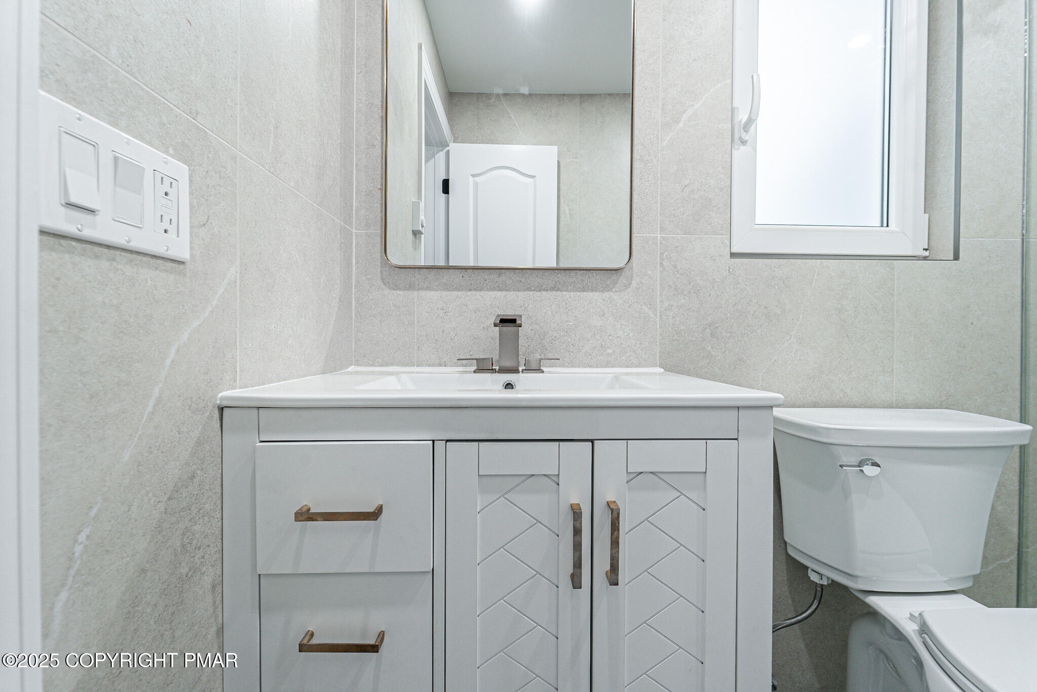 5806 Decker Road Bushkill, PA 18324 - Photo 50 of 76 a bathroom with a sink vanity and a toilet