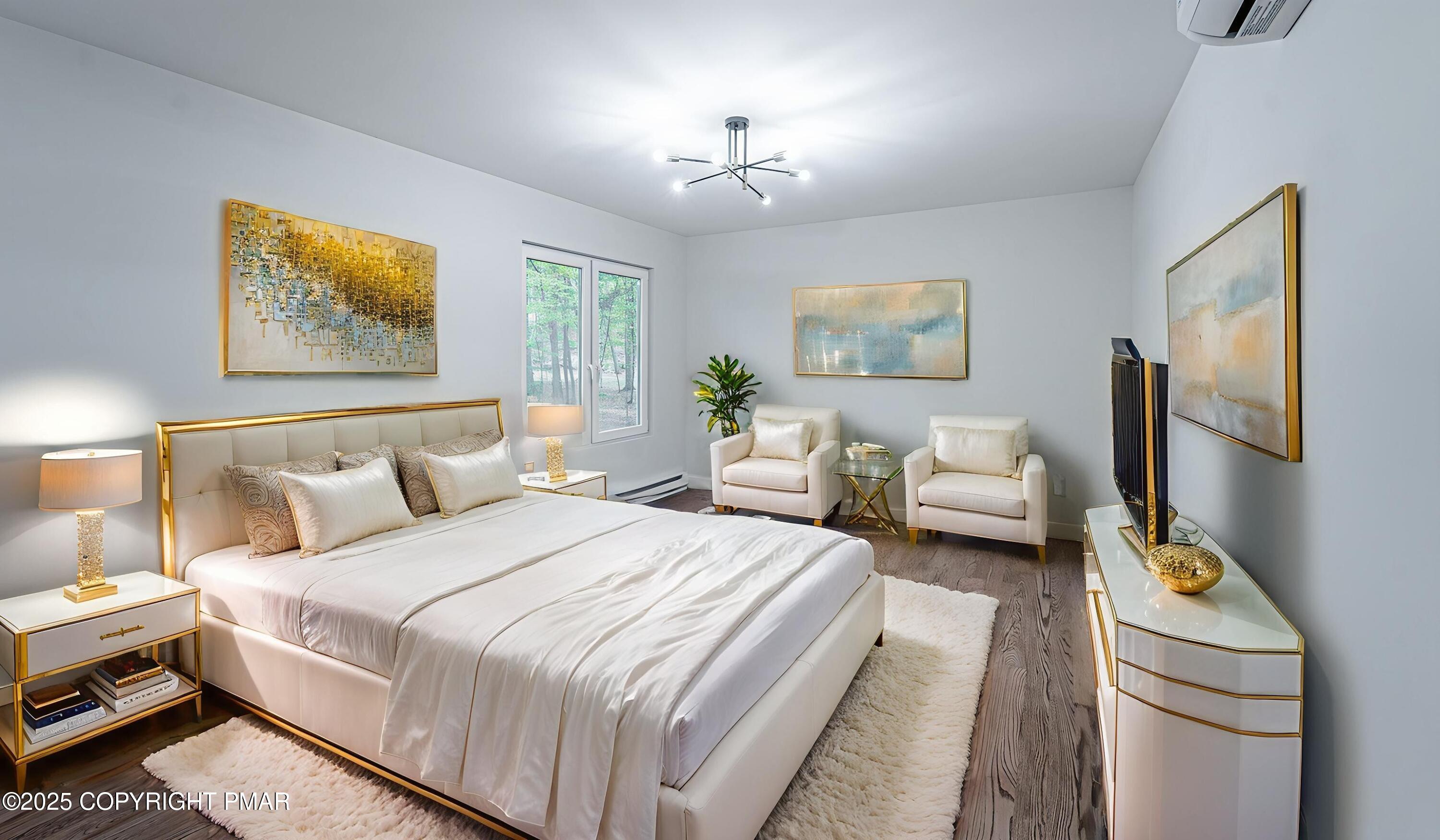 5806 Decker Road Bushkill, PA 18324 - Photo 54 of 76 a spacious bedroom with a bed a couch and a window