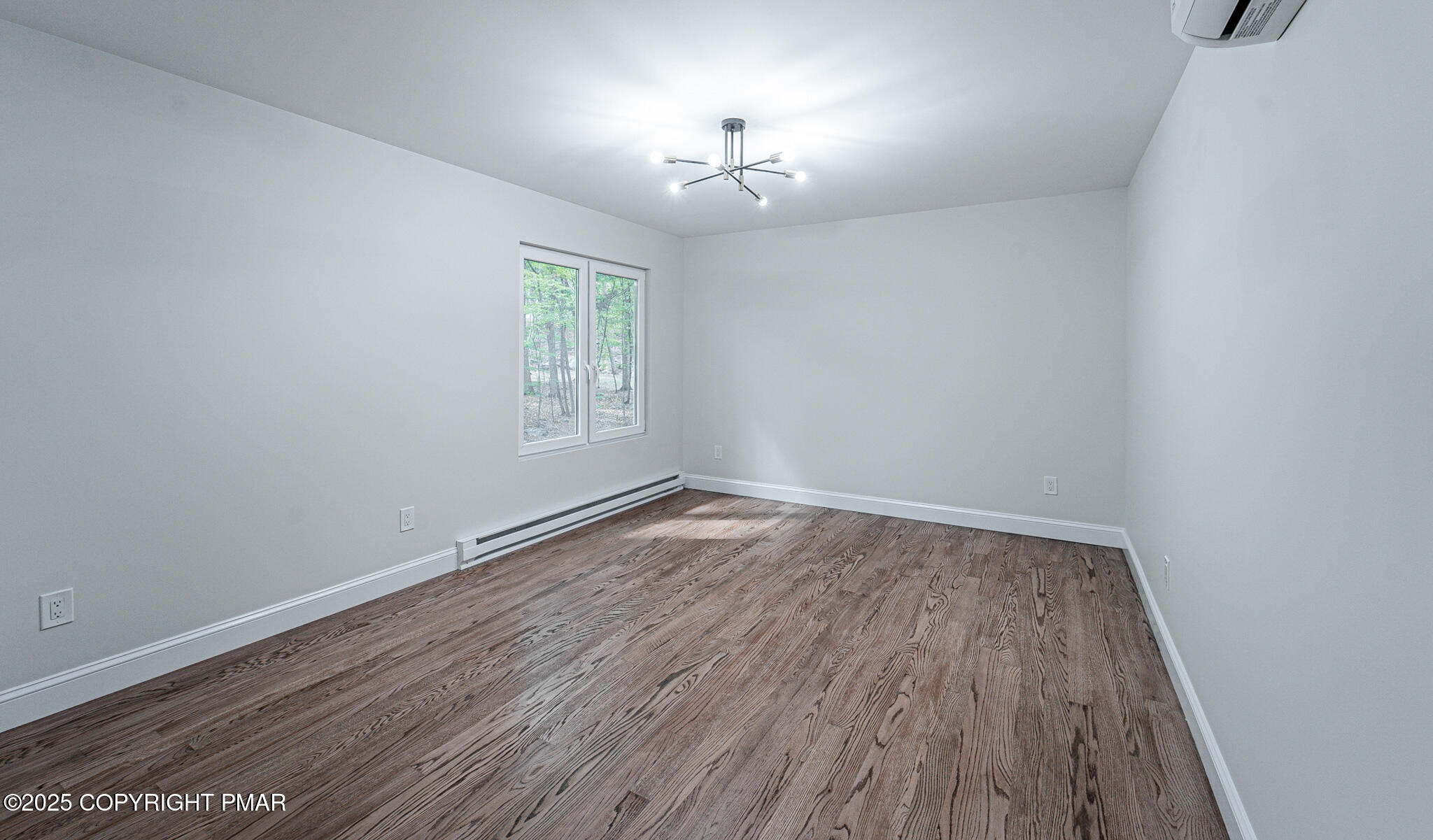5806 Decker Road Bushkill, PA 18324 - Photo 55 of 76 wooden floor in an empty room with a window