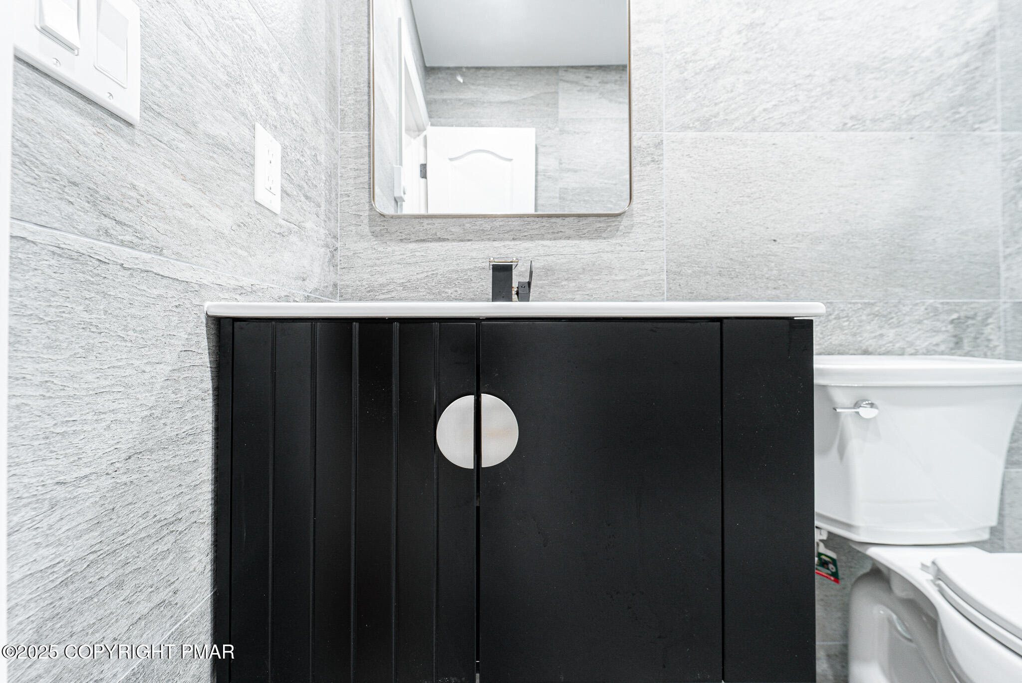 5806 Decker Road Bushkill, PA 18324 - Photo 59 of 76 a bathroom with a sink and a mirror