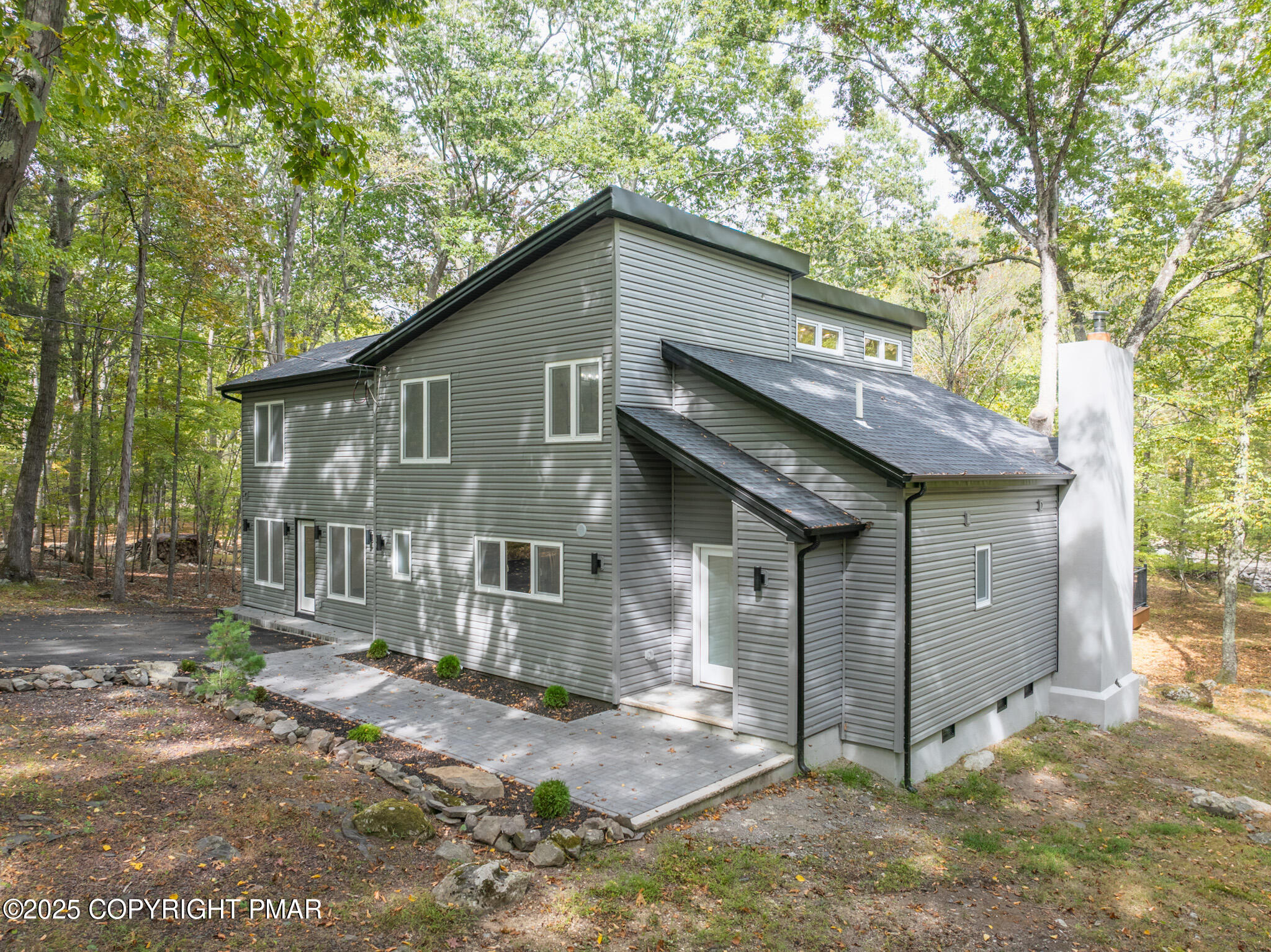 5806 Decker Road Bushkill, PA 18324 - Photo 64 of 76 a front view of a house with a tree