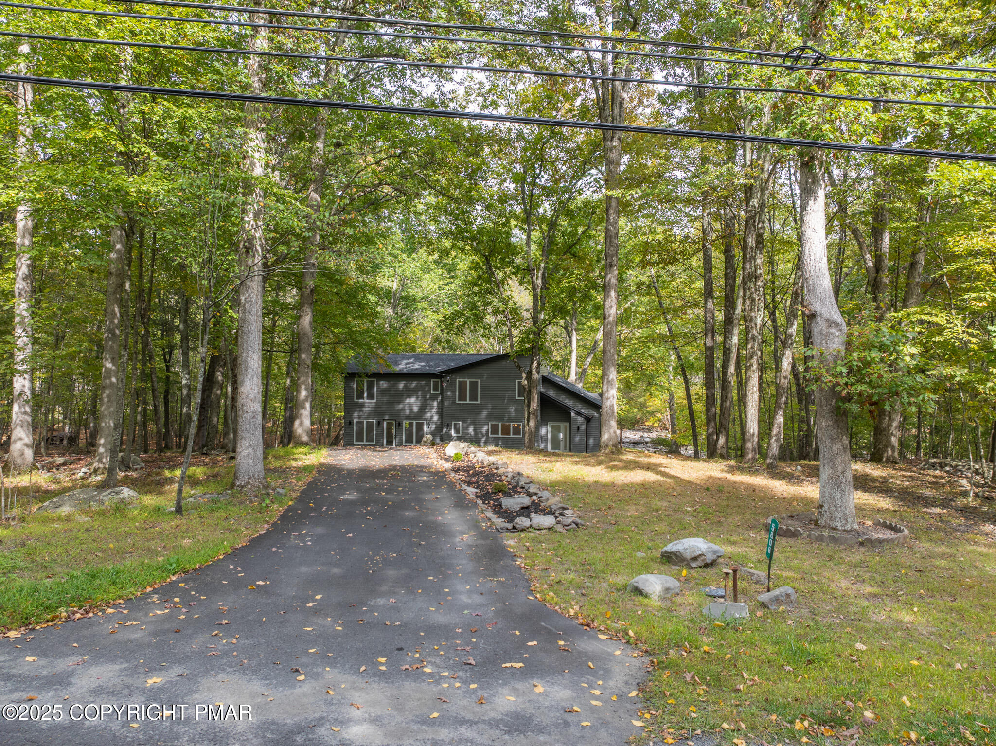 5806 Decker Road Bushkill, PA 18324 - Photo 67 of 76 a view of a street with a building and trees in the background