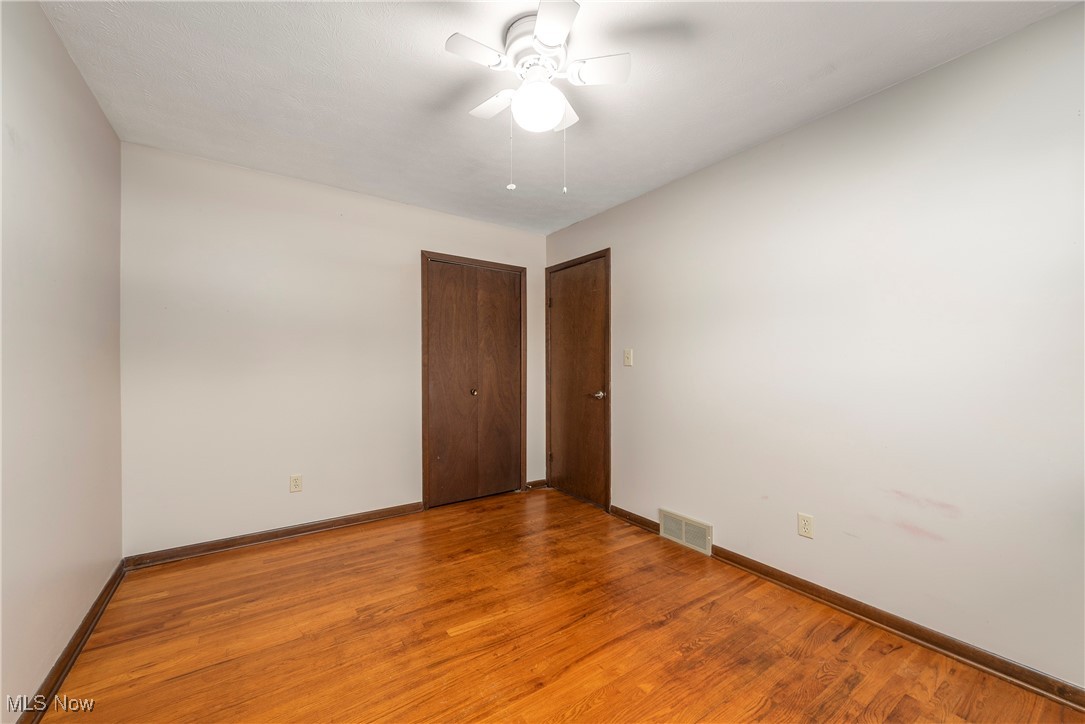 7717 Hoertz Road Cleveland, OH 44134 - Photo 25 of 49 Empty room featuring light hardwood / wood-style flooring and ceiling fan