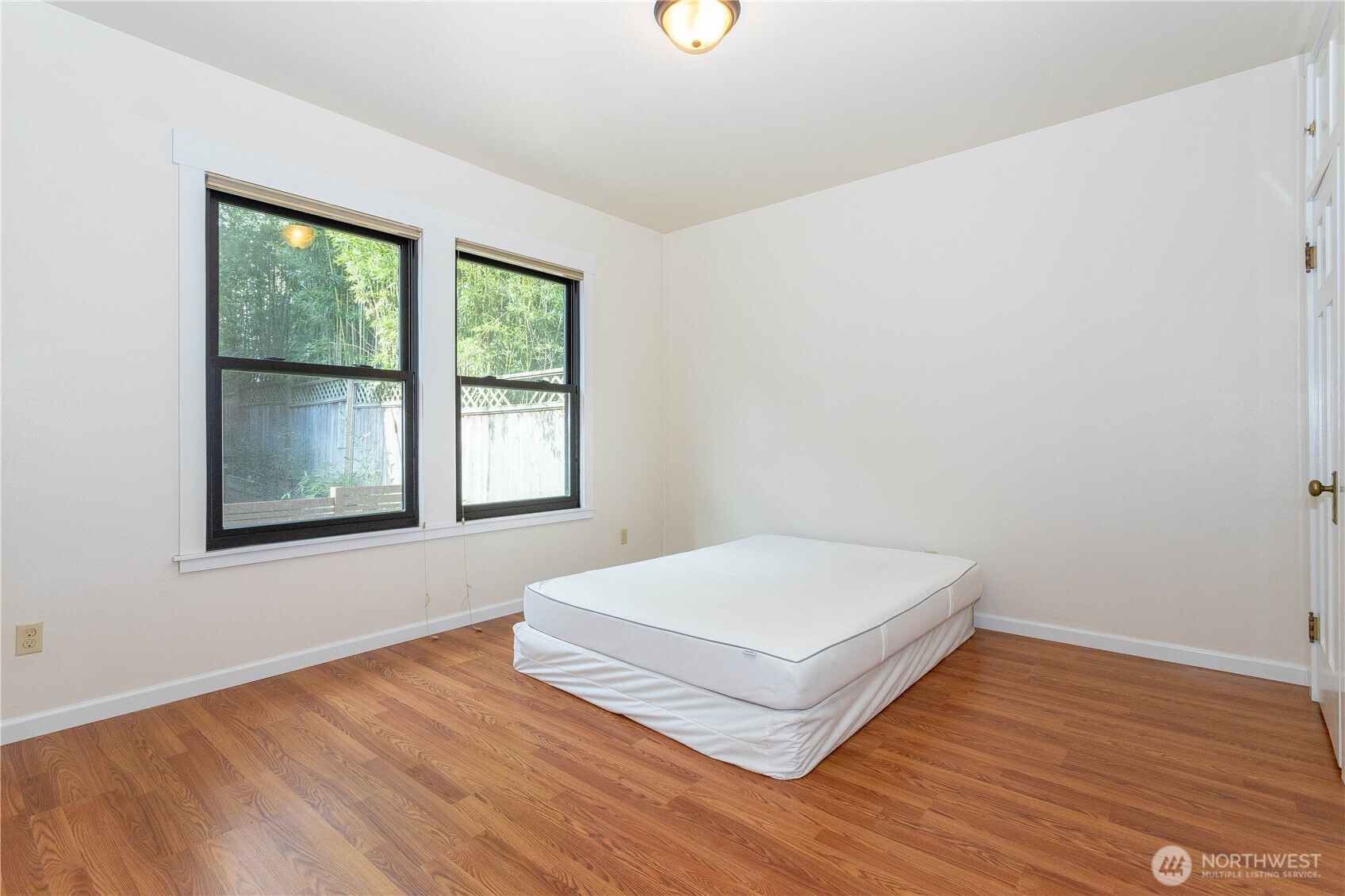 3010 East Spruce Street Seattle, WA 98122 - Photo 14 of 20 a view of wooden floor and windows in a room