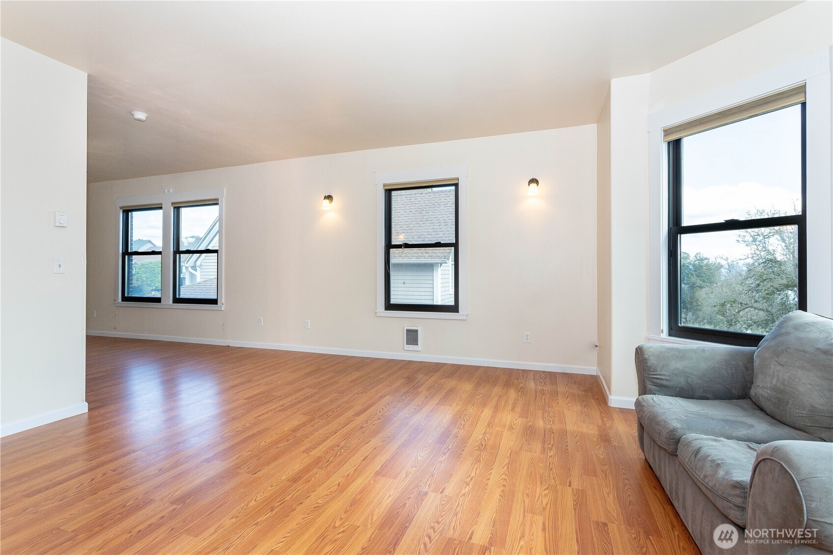 3010 East Spruce Street Seattle, WA 98122 - Photo 5 of 20 wooden floor in an empty room with a window