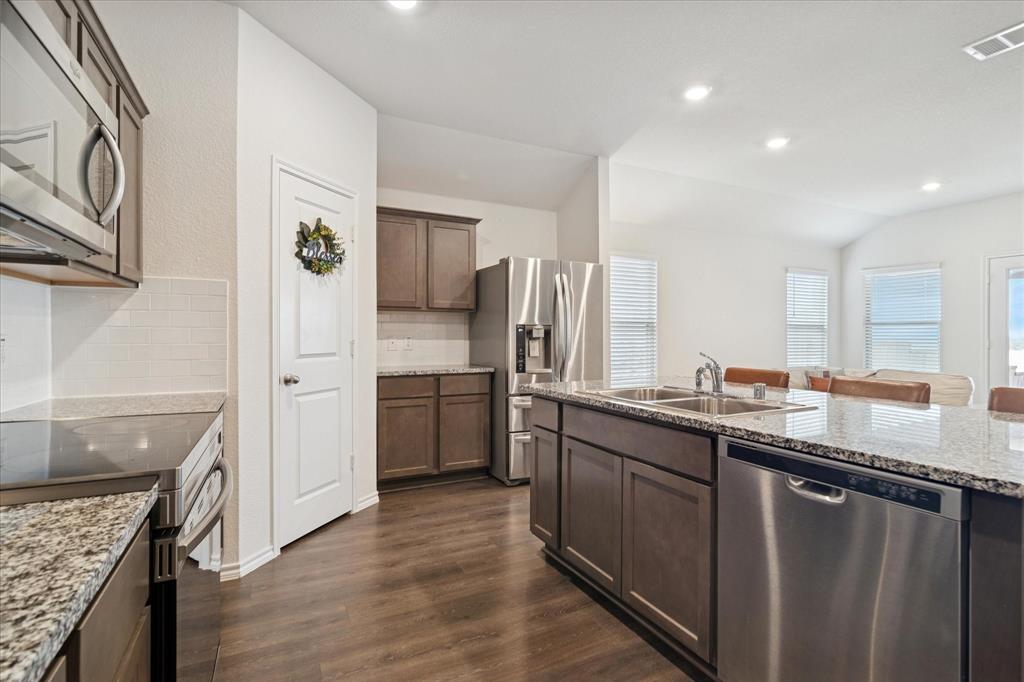 1132 Rountree Court Celina, TX 75009 - Photo 11 of 27 You will find there is plenty of cabinet space for all of your needs. With a nice sized walk in pantry.