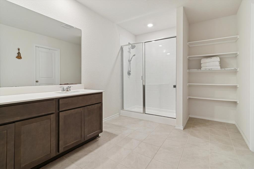 1132 Rountree Court Celina, TX 75009 - Photo 15 of 27 Huge primary bath with stand alone shower and a very spacious closet!