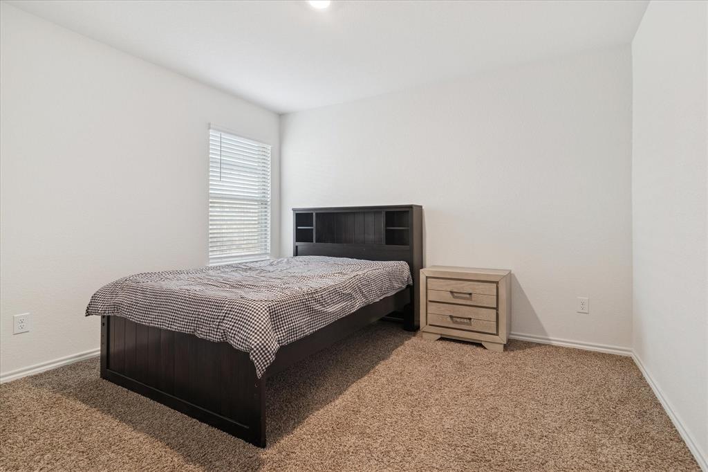 1132 Rountree Court Celina, TX 75009 - Photo 19 of 27 Secondary bedroom on the other side of a full bath, all with great closet space.