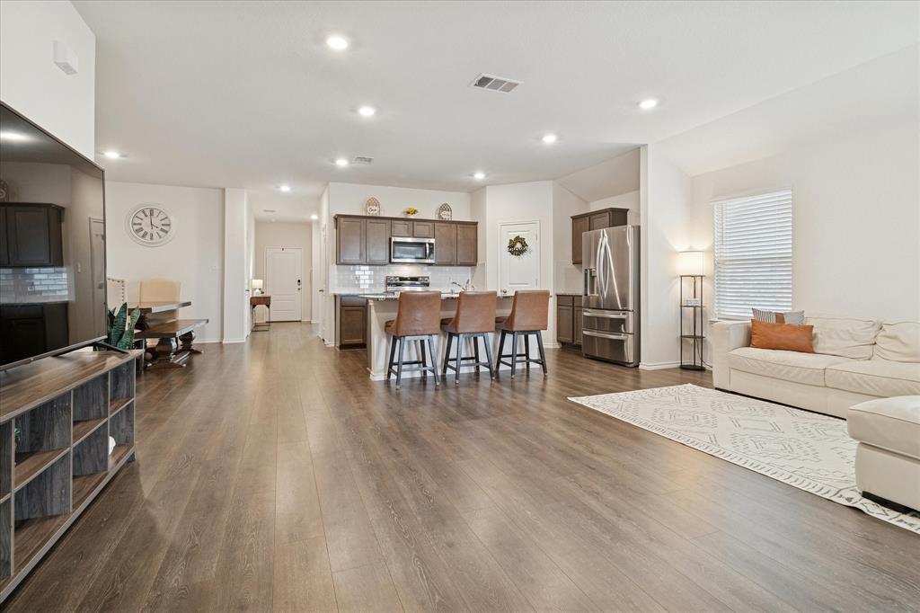 1132 Rountree Court Celina, TX 75009 - Photo 10 of 27 Kitchen Opens to living room so the chef never misses out on family time or the rear scenic views.