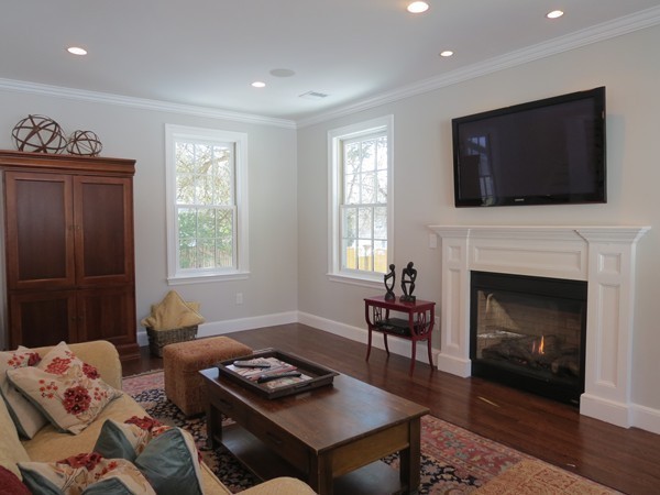 8 Windemere Road Wellesley, MA 02481 - Photo 13 of 20 a living room with furniture a flat screen tv and a fireplace