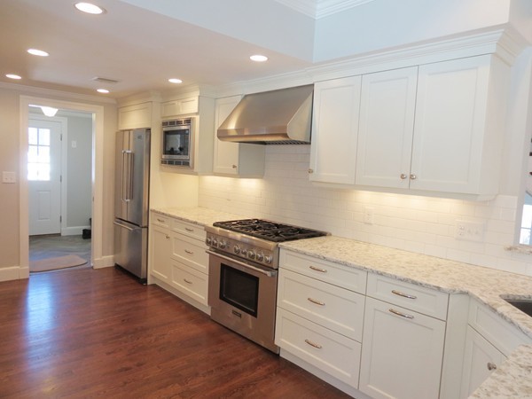 8 Windemere Road Wellesley, MA 02481 - Photo 8 of 20 a kitchen with stainless steel appliances granite countertop a stove and a refrigerator