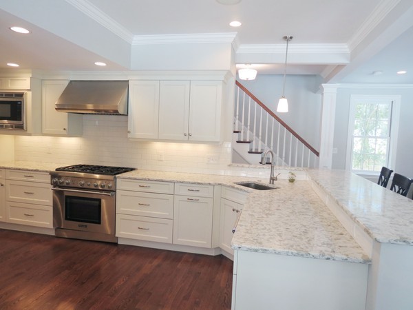 8 Windemere Road Wellesley, MA 02481 - Photo 9 of 20 a kitchen with granite countertop a sink a stove and cabinets