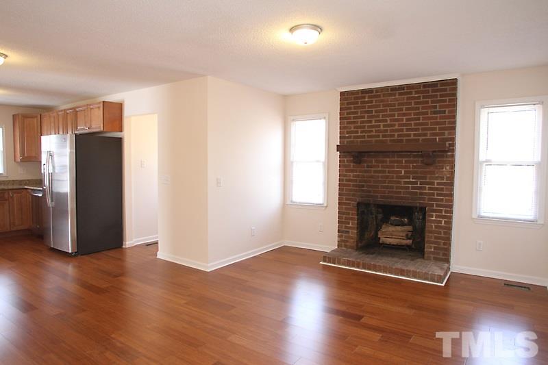 608 Sawmill Road Raleigh, NC 27615 - Photo 3 of 13 More hardwoods and masonry fireplace! Open to Kitchen.