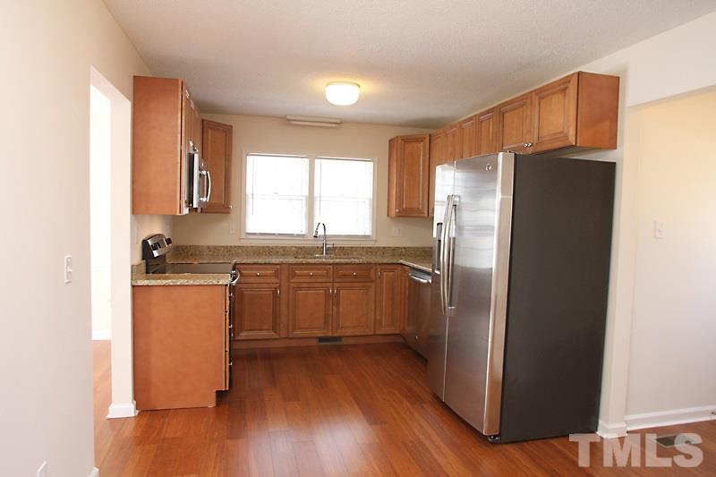 608 Sawmill Road Raleigh, NC 27615 - Photo 5 of 13 All new with soft-close cabinets, granite countertops and GE stainless appliances...Gorgeous!