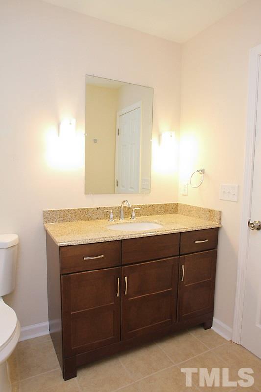 608 Sawmill Road Raleigh, NC 27615 - Photo 8 of 13 New tile floors, vanity with solid surface countertop, new tub/shower, toilet and lighting!