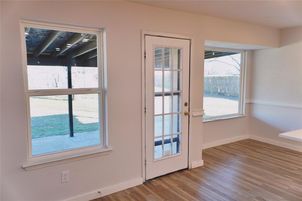 6357 Cascade Circle Watauga, TX 76148 - Photo 11 of 22 a view of empty room with wooden floor and fan