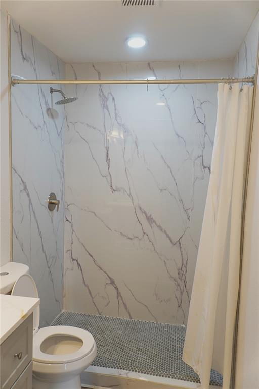 6357 Cascade Circle Watauga, TX 76148 - Photo 12 of 22 a bathroom with a toilet and a shower