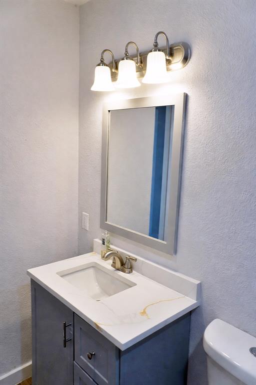 6357 Cascade Circle Watauga, TX 76148 - Photo 13 of 22 a bathroom with a sink and a toilet