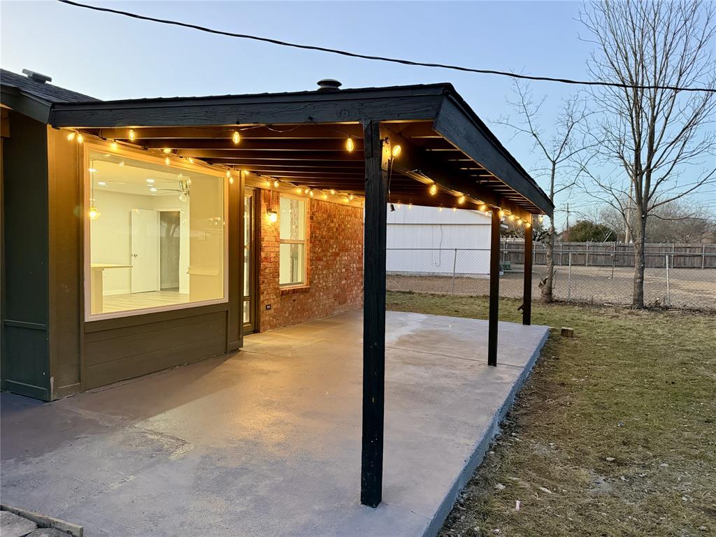 6357 Cascade Circle Watauga, TX 76148 - Photo 20 of 22 a empty room with sliding door and wooden floor