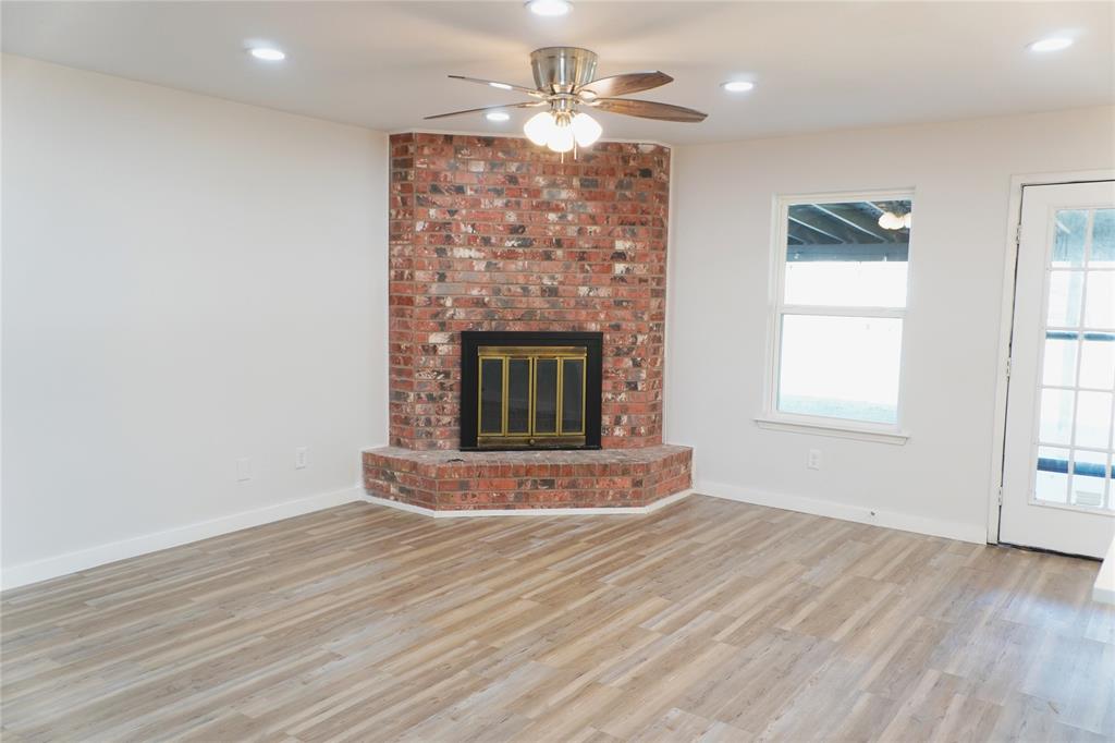 6357 Cascade Circle Watauga, TX 76148 - Photo 2 of 22 a view of a livingroom with a fireplace and window