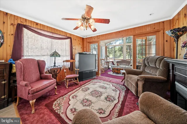 a living room with furniture fireplace and a flat screen tv