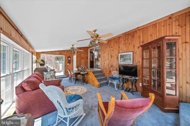a kitchen with granite countertop a sink stainless steel appliances and cabinets