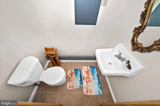 a living room with furniture a rug and a large window