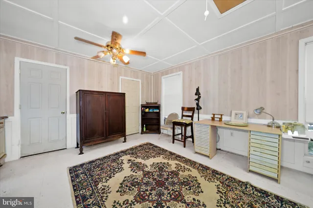 a view of a house with backyard porch and sitting area