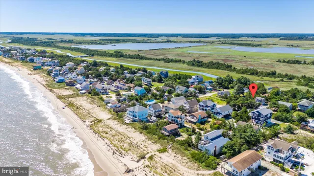 an aerial view of residential building and lake