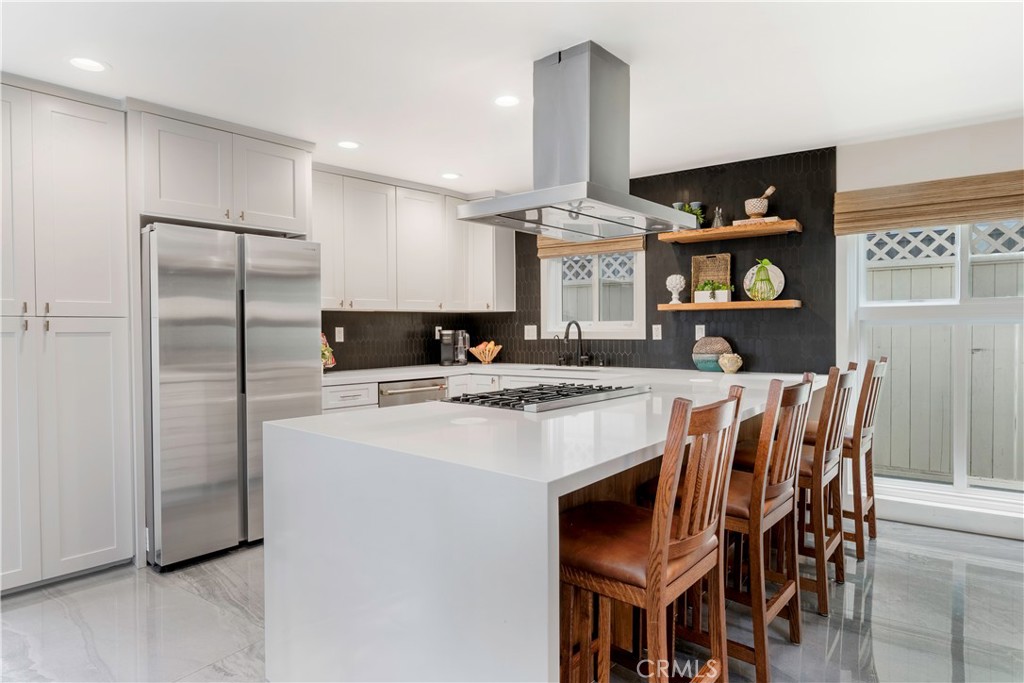 35 Geneva Walk Long Beach, CA 90803 - Photo 12 of 36 a kitchen with stainless steel appliances granite countertop a stove a refrigerator and a refrigerator