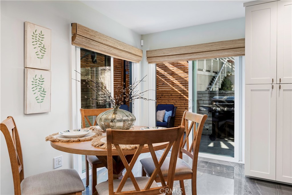 35 Geneva Walk Long Beach, CA 90803 - Photo 19 of 36 a view of a dining room with furniture window and outside view