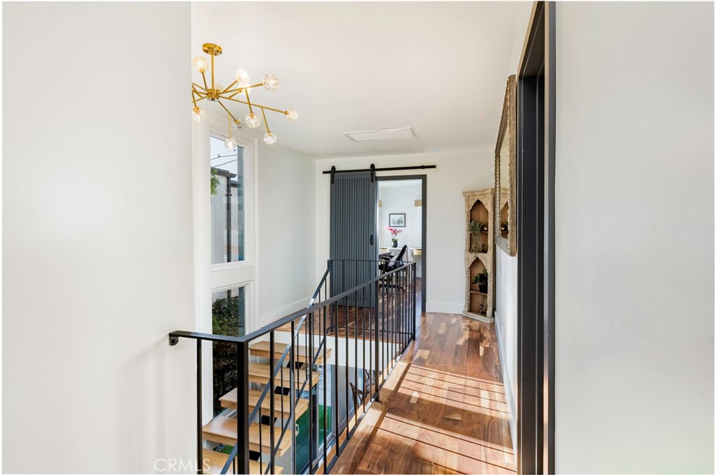 35 Geneva Walk Long Beach, CA 90803 - Photo 24 of 36 a view of a hallway with wooden floor and staircase