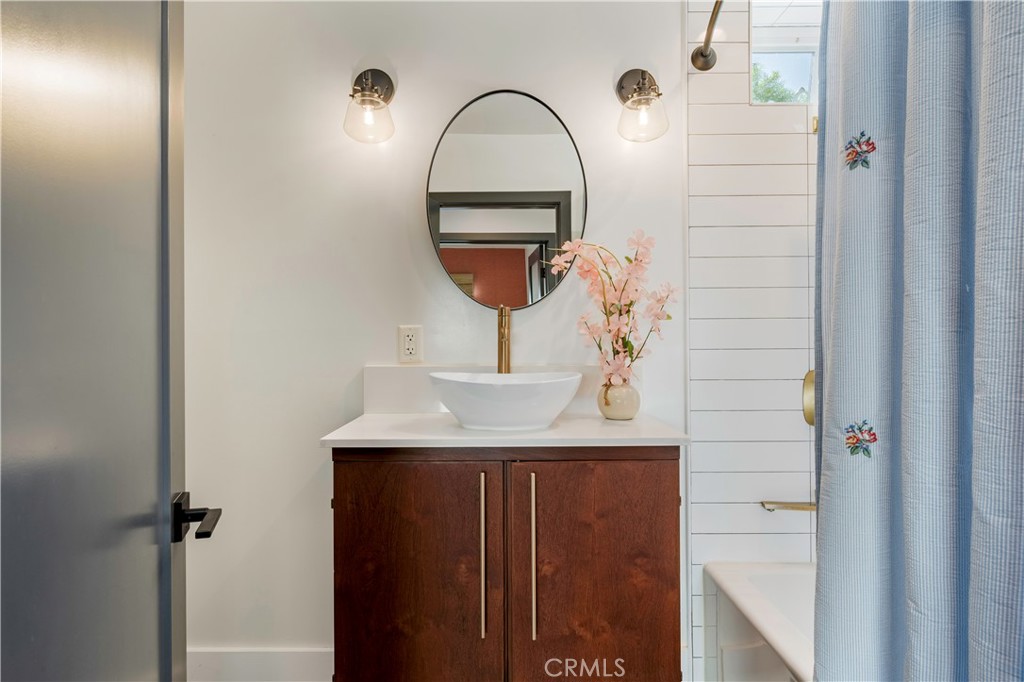 35 Geneva Walk Long Beach, CA 90803 - Photo 27 of 36 a bathroom with a sink and a mirror
