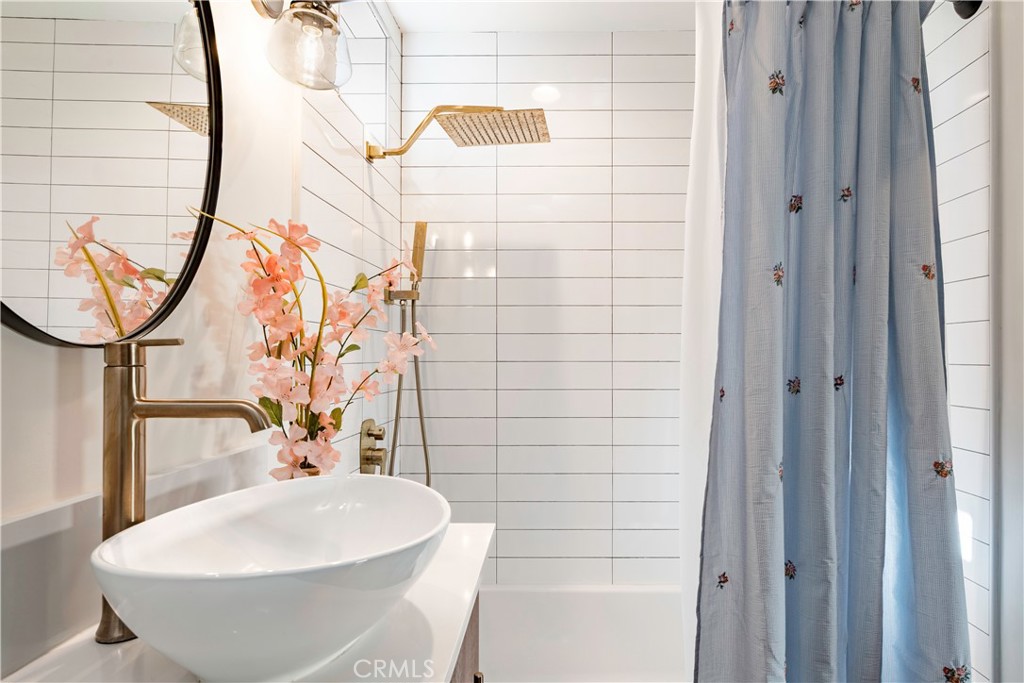 35 Geneva Walk Long Beach, CA 90803 - Photo 28 of 36 a bathroom with a sink and a mirror