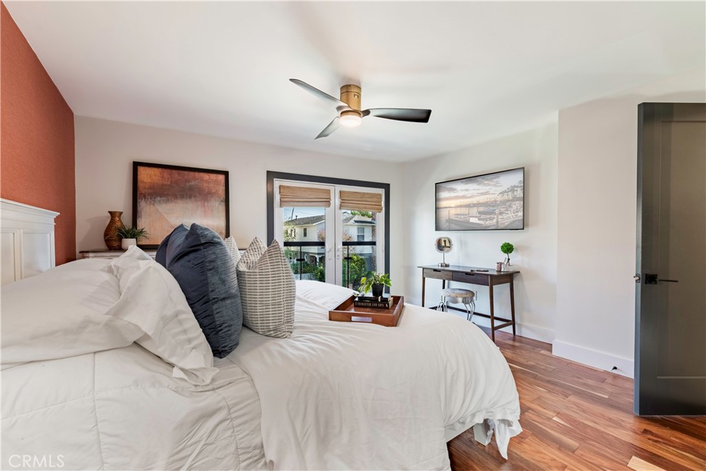 35 Geneva Walk Long Beach, CA 90803 - Photo 32 of 36 a large bedroom with a bed large window with table and chair