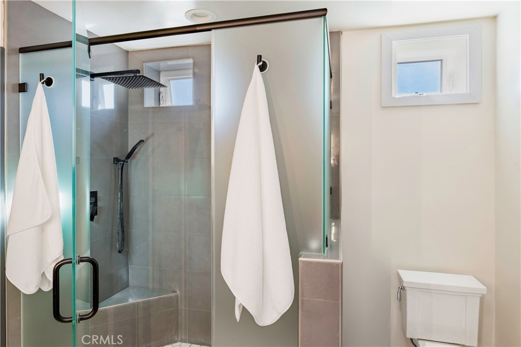 35 Geneva Walk Long Beach, CA 90803 - Photo 35 of 36 a view of walk in closet with clothes and shower