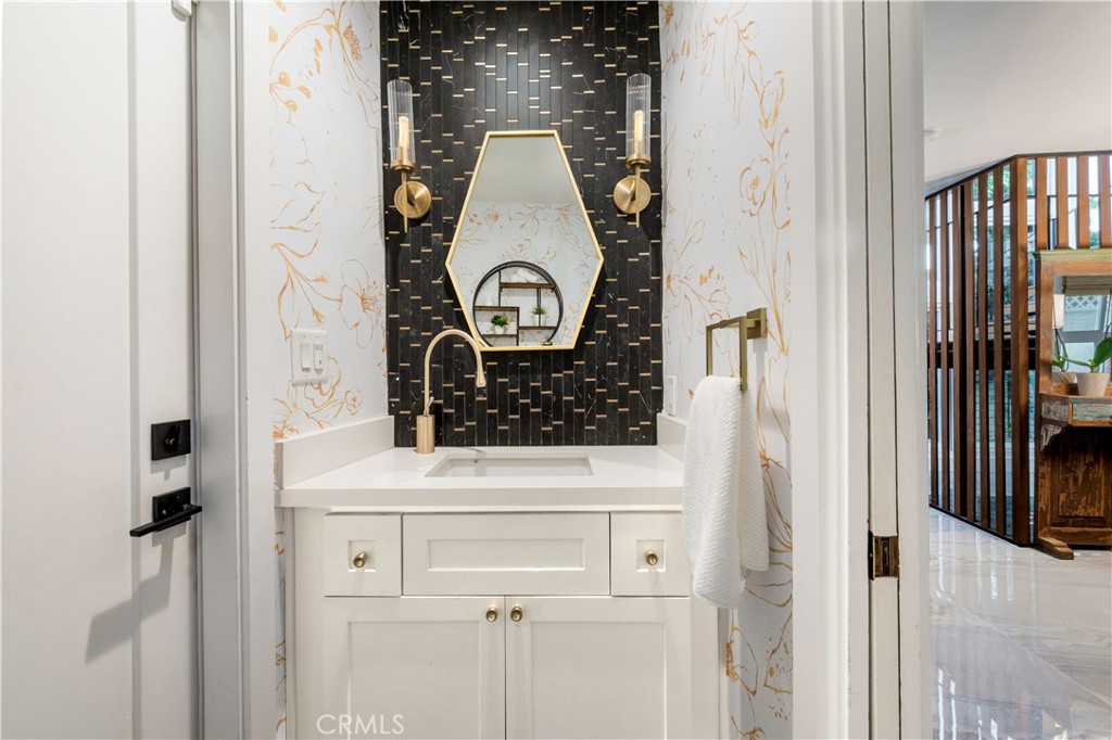 35 Geneva Walk Long Beach, CA 90803 - Photo 6 of 36 a bathroom with a sink and a mirror