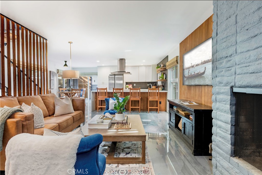 35 Geneva Walk Long Beach, CA 90803 - Photo 9 of 36 a living room with furniture and a fireplace