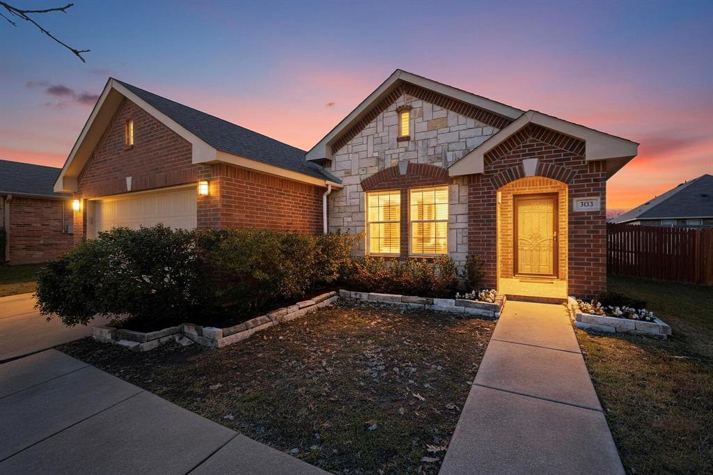 303 Laurel Lane Fate, TX 75087 - Photo 1 of 33 a front view of a house