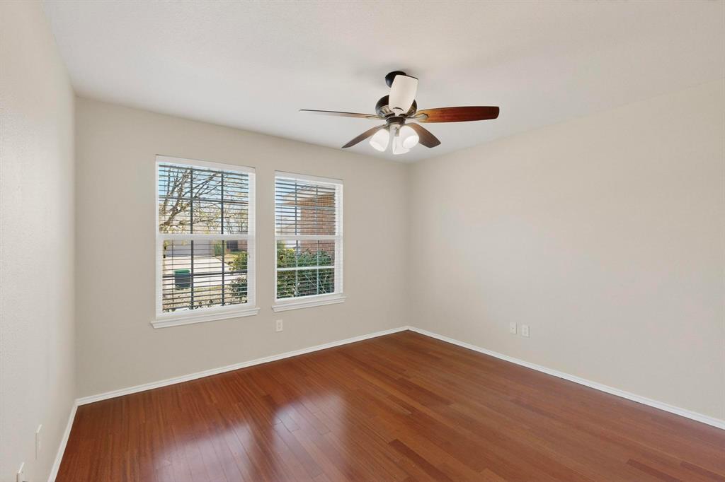 303 Laurel Lane Fate, TX 75087 - Photo 24 of 33 a view of a big room with wooden floor and windows
