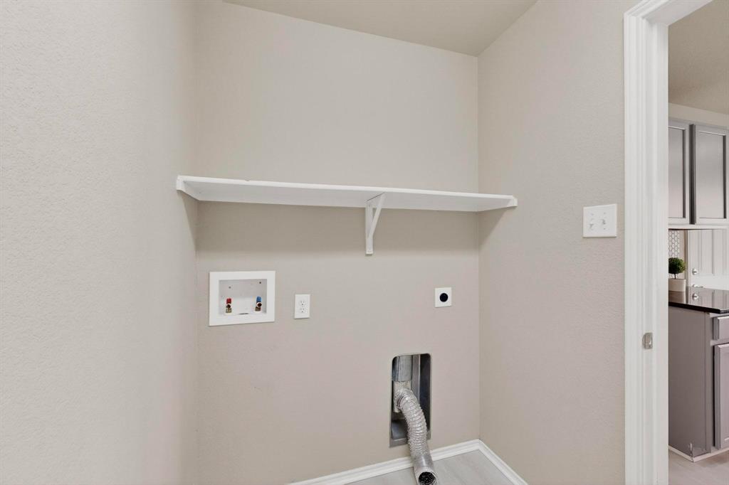 303 Laurel Lane Fate, TX 75087 - Photo 27 of 33 a view of cupboard