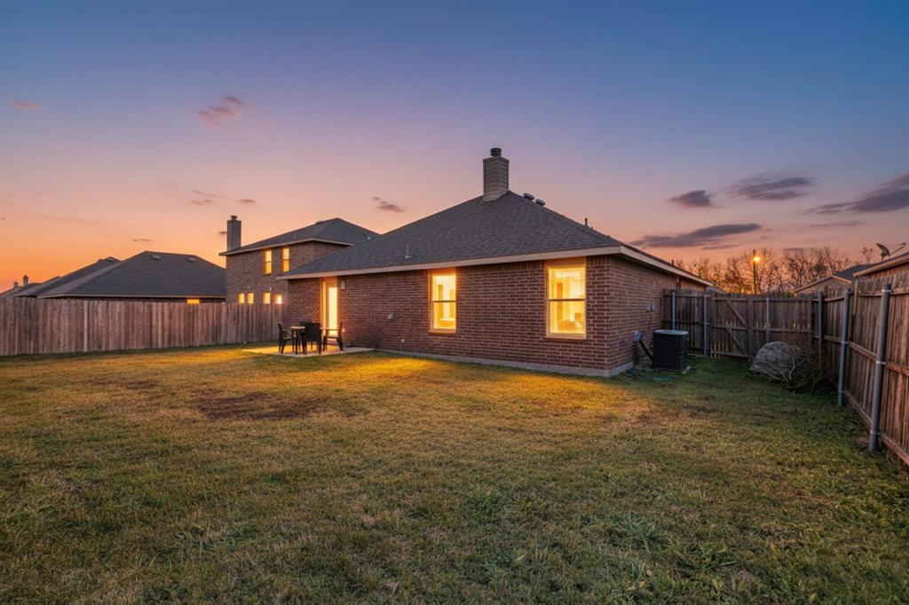 303 Laurel Lane Fate, TX 75087 - Photo 29 of 33 a backyard of a house
