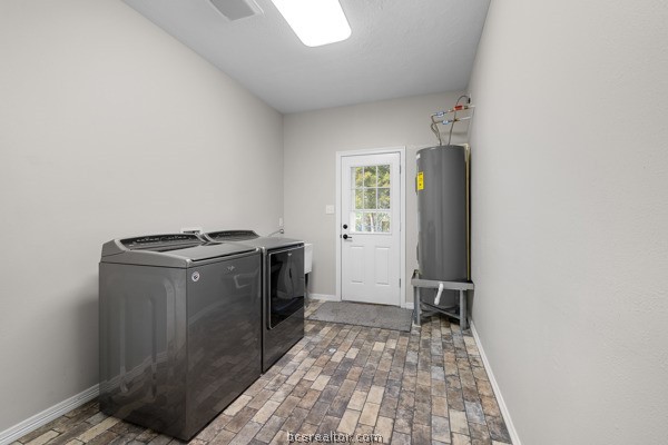 12 Raven's Nest Bryan, TX 77808 - Photo 19 of 46 a utility room with dryer and washer