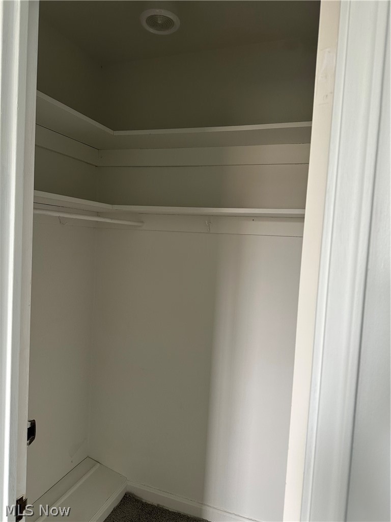 13800 Fairhill Road, Unit 416 Shaker Heights, OH 44120 - Photo 11 of 13 Walk-in closet with built-in shelving, hanging rod, recessed lighting, and carpet flooring